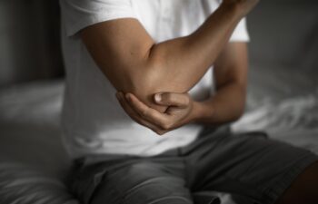 Man with elbow injury, pain relief concept concept muscle pain due to lateral epicondylitis or tennis elbow injury, Health care concept